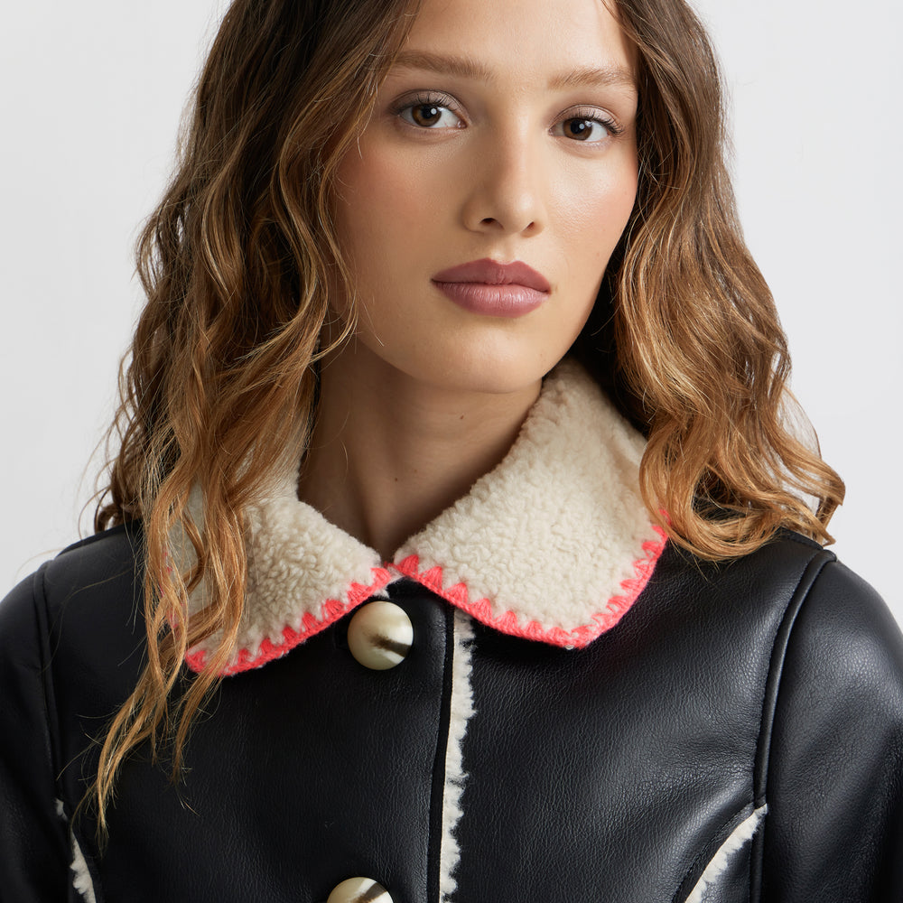 
                      
                        Mouton Coat
                      
                    