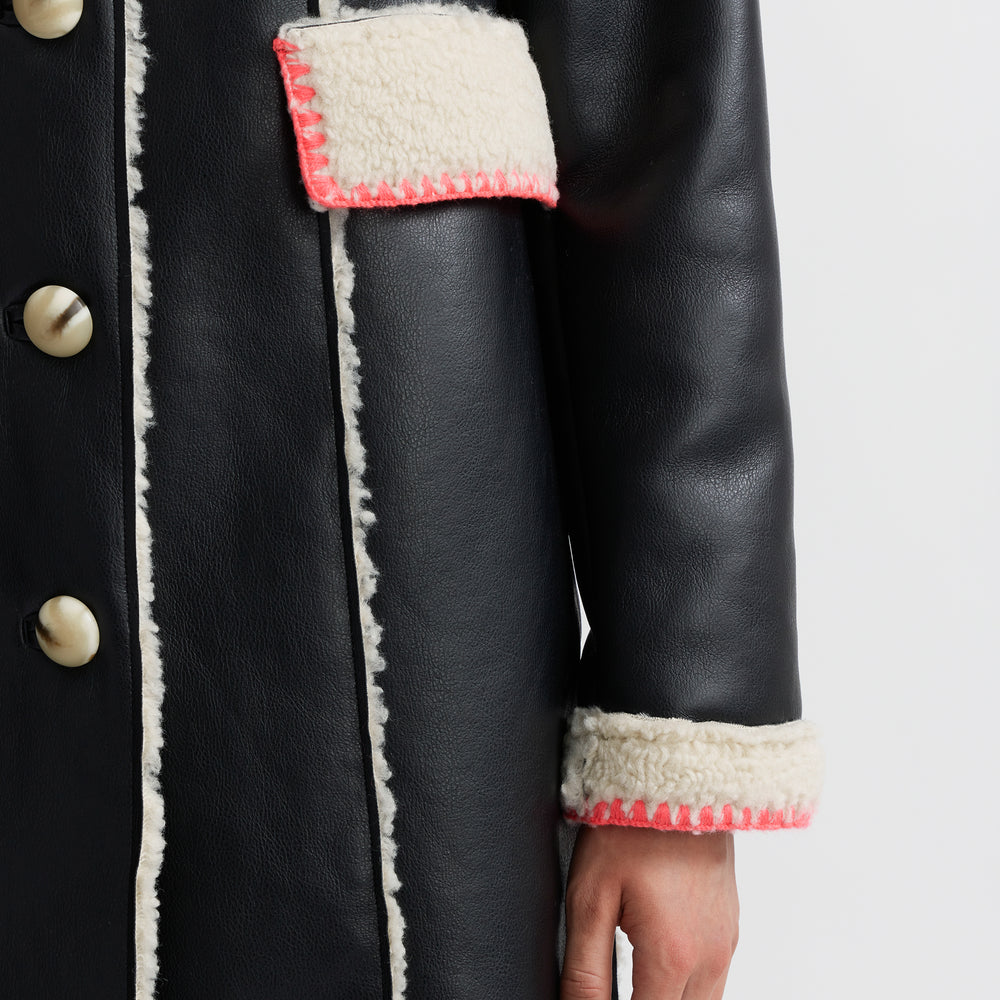 
                      
                        Mouton Coat
                      
                    