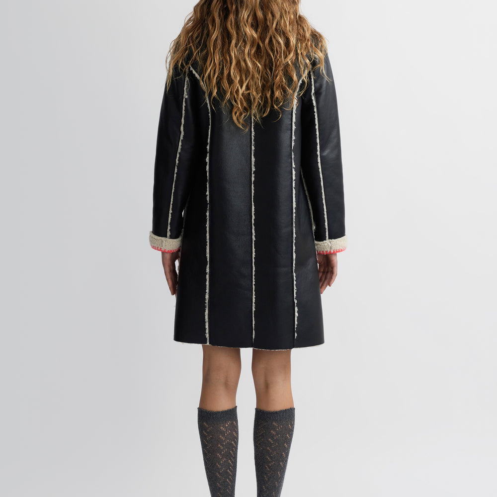 
                      
                        Mouton Coat
                      
                    